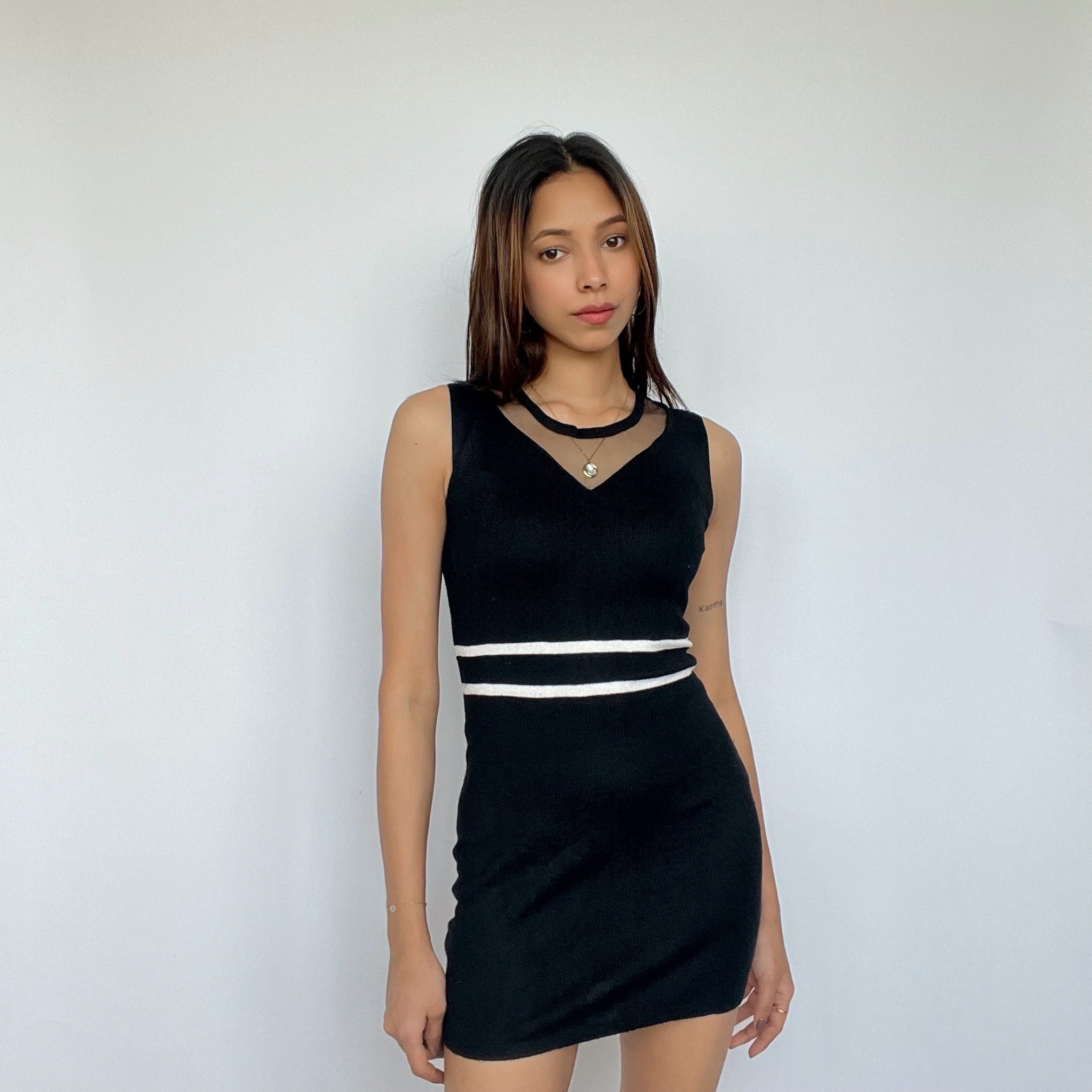 Black mesh-neck bodycon dress